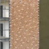 Professional K Rend external wall insulation installation showing insulation boards fixed to building wall with mechanical fixings and adhesive, demonstrating proper EWI system application techniques