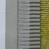Cross-section of wall insulation layers: plaster, adhesive, reinforcing mesh, adhesive layer, and mineral wool.