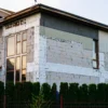 UK house during external wall insulation with EPS boards — window reveals visible