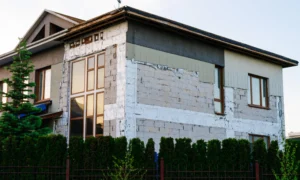 UK house during external wall insulation with EPS boards — window reveals visible