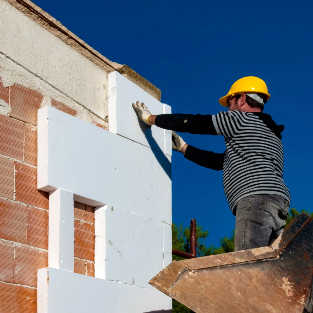 k rend base coat system on external wall insulation boards during facade build-up